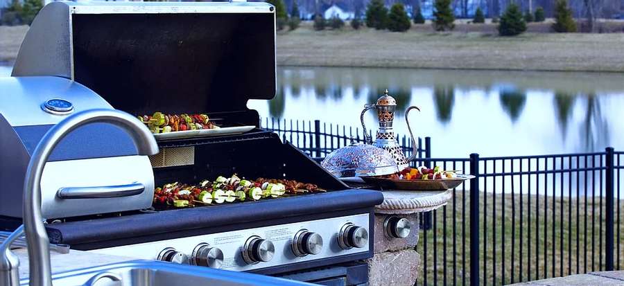 grill with food near lake