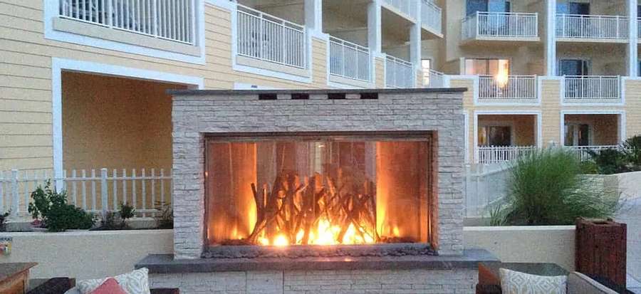 large outdoor fireplace near apartments